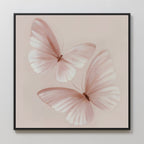 Blush Wings Canvas Art displays two delicate, pale pink butterflies with translucent wings on a soft beige background. This elegant wall decor adds a light, serene touch to any room.