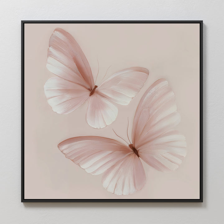 Blush Wings Canvas Art displays two delicate, pale pink butterflies with translucent wings on a soft beige background. This elegant wall decor adds a light, serene touch to any room.