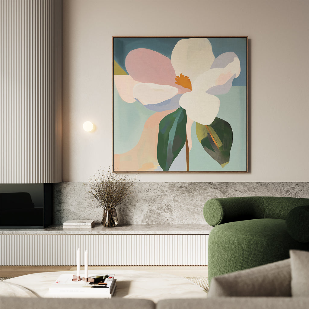 A modern living room featuring the Bold Bloom Canvas Art—an abstract floral painting—paired with a green curved armchair, marble shelf, dried flowers in a vase, and books with candles on a white table for elegant style.