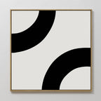 Bold Orbit Canvas Art features two thick black curved bands on a white background, framed in light wood. Mounted on a white wall, it’s ideal minimalist abstract wall art for modern interiors.