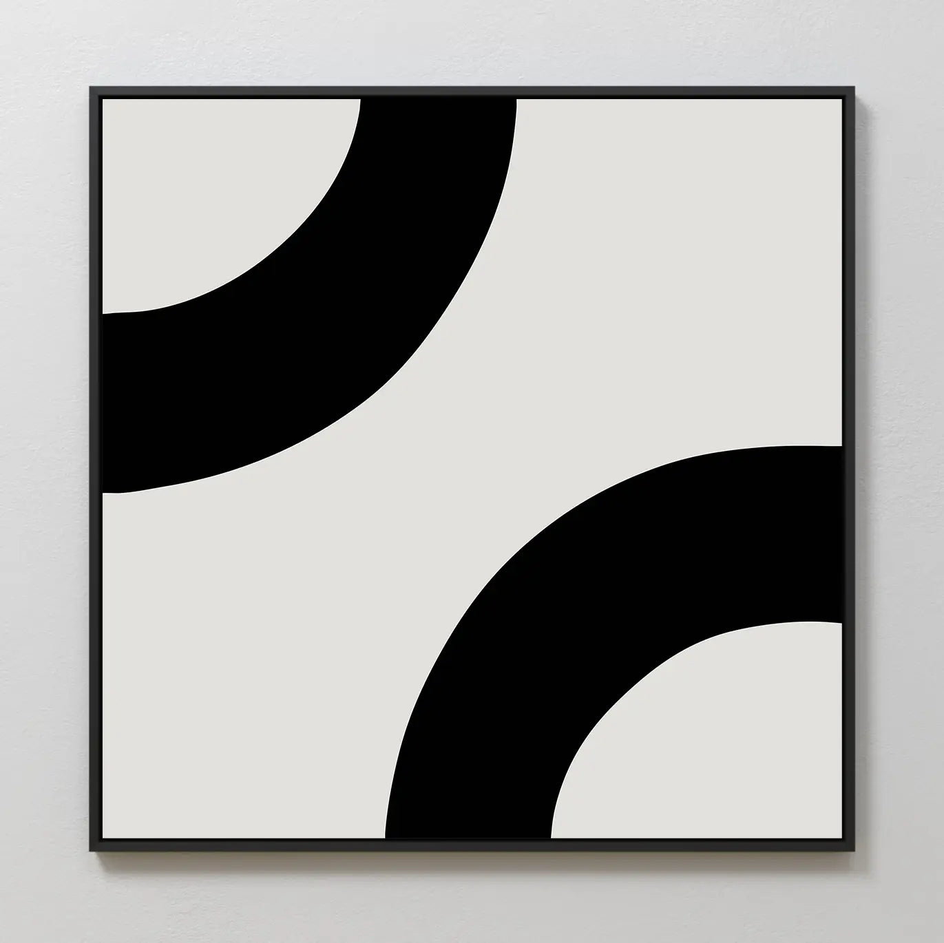 Bold Orbit Canvas Art: This minimalist piece features two thick black curved bands at opposite corners on a light background, framed in black—an ideal abstract wall art choice for modern interiors.