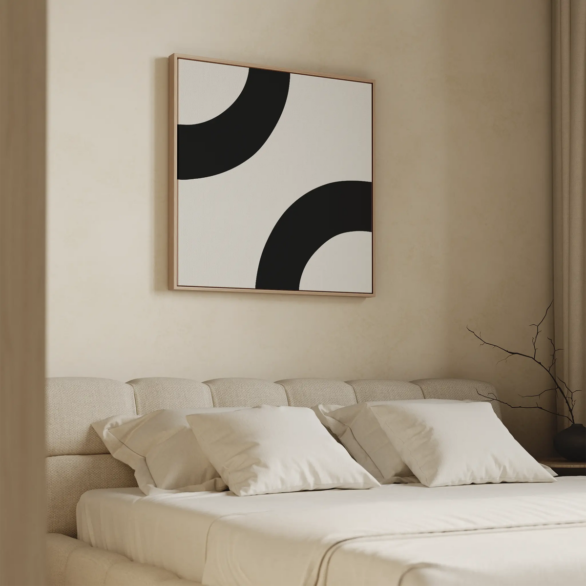 A minimalistic bedroom features a beige upholstered bed with white bedding and Bold Orbit Canvas Art—abstract wall art with curved shapes—hung above the headboard. A simple vase with twigs on the bedside table enhances the serene, modern vibe.