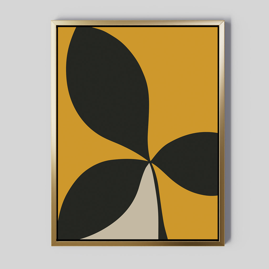 Botanic Contrast Abstract Canvas Art in a gold frame features bold black and beige leaf-like shapes on a mustard yellow background—perfect minimalist wall art or striking modern decor for your living room.