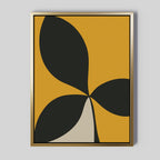 Botanic Contrast Abstract Canvas Art in a gold frame features bold black and beige leaf-like shapes on a mustard yellow background—perfect minimalist wall art or striking modern decor for your living room.
