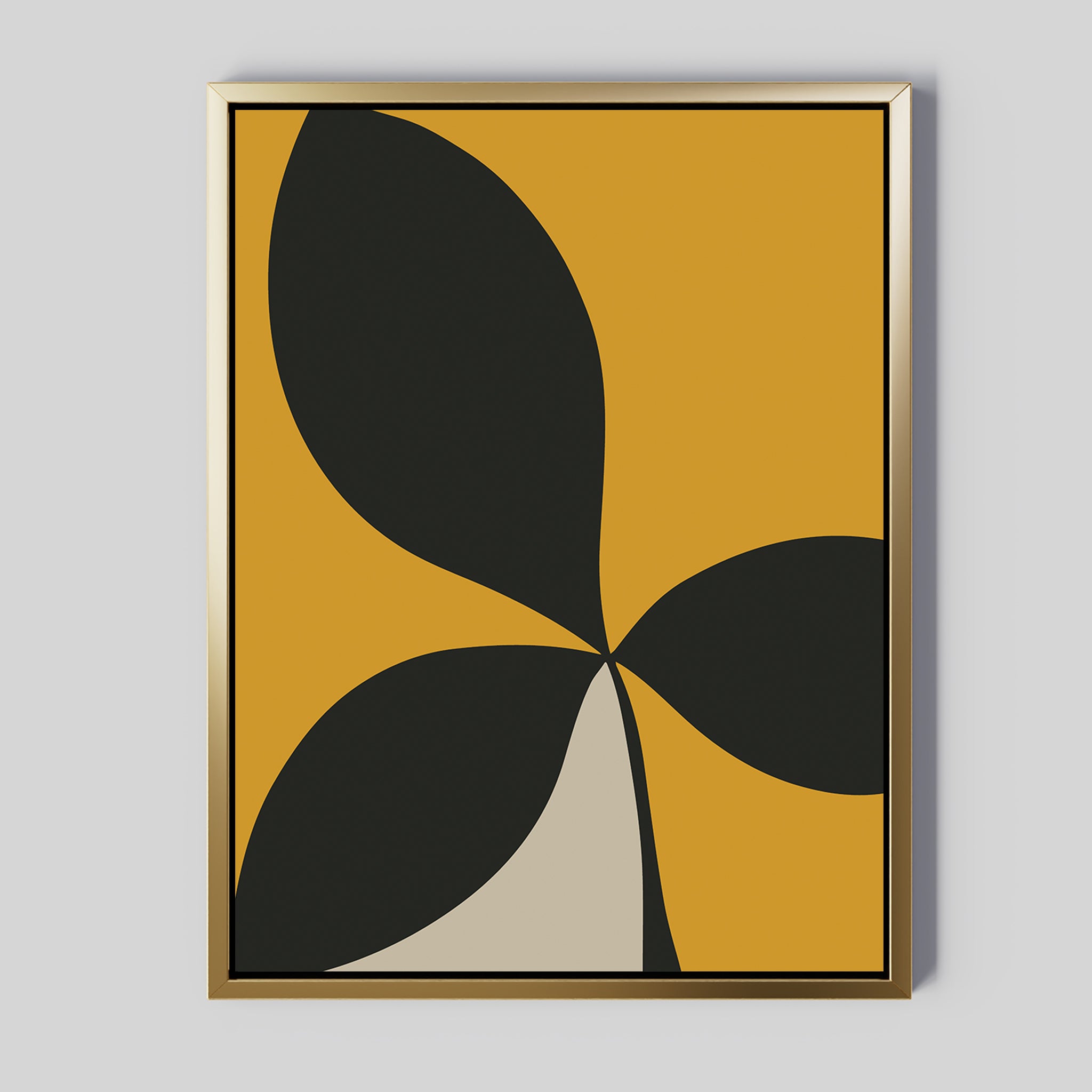 Botanic Contrast Abstract Canvas Art in a gold frame features bold black and beige leaf-like shapes on a mustard yellow background—perfect minimalist wall art or striking modern decor for your living room.