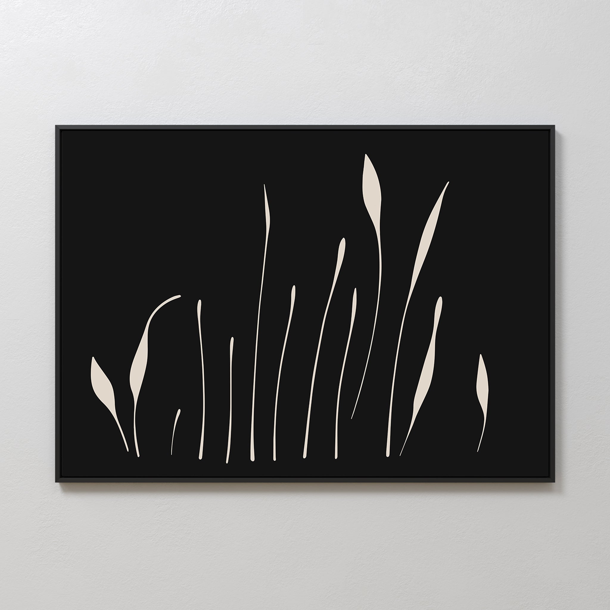 Botanical Silhouettes Abstract Canvas Art features minimalist wall decor with a black background and cream curved lines resembling abstract grass or floral shapes, beautifully framed and displayed on a light wall.