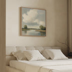 A serene bedroom features the Calm Passage Canvas Art—a large painting of a river and trees above a beige upholstered bed with white pillows. Soft lighting and neutral tones enhance the calm, inviting atmosphere.