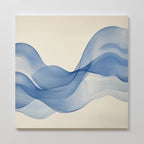 The Calm Swell Canvas Art features flowing, overlapping blue wave-like shapes on a light beige background, creating a sense of movement and calm. Its soft tones and airy feel make it perfect for adding relaxing decor to your living room.