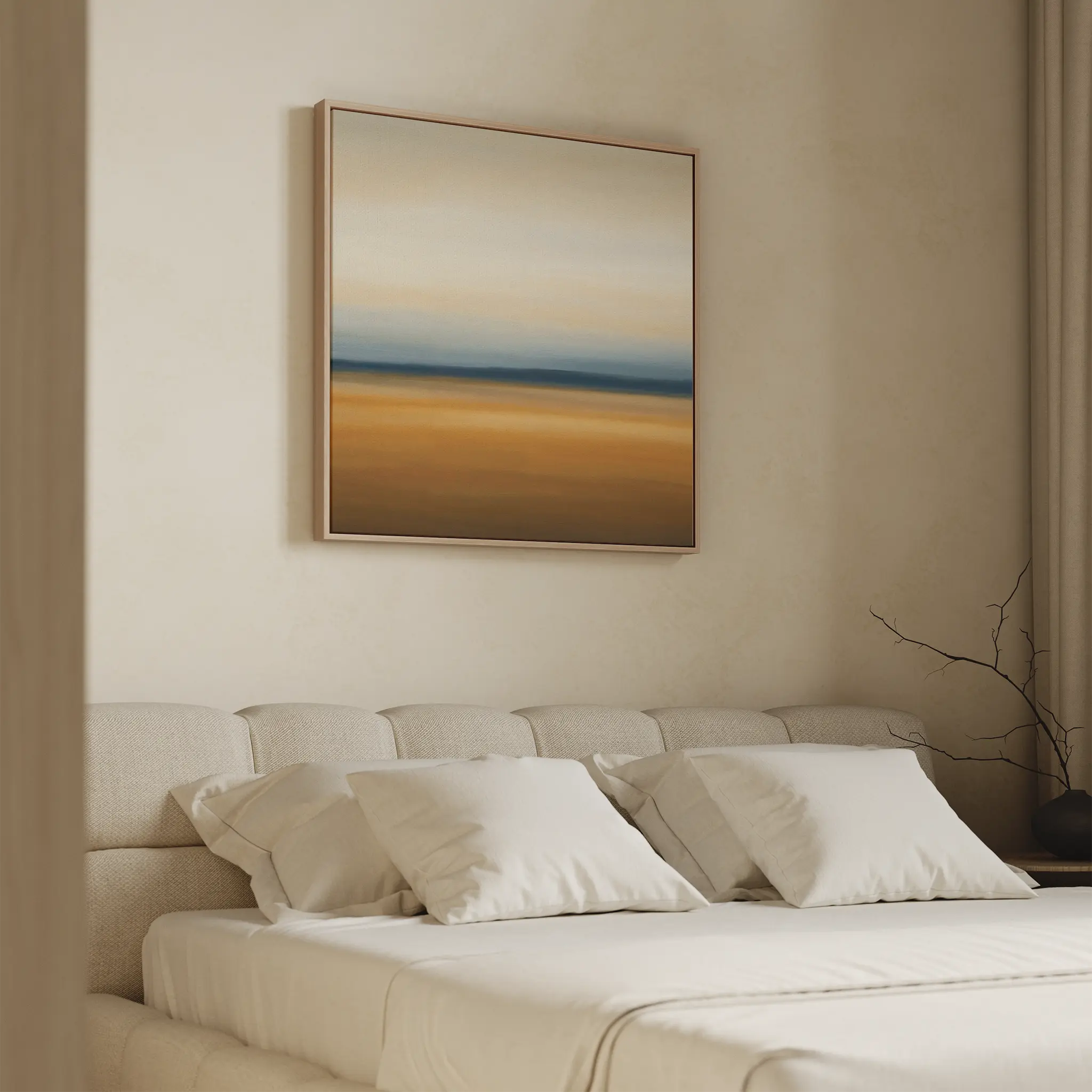 A minimalist bedroom features a beige upholstered bed, white pillows, and a neutral wall adorned with Caramel Plains Canvas Art in earthy tones and soft gradients, creating a calm and serene atmosphere.