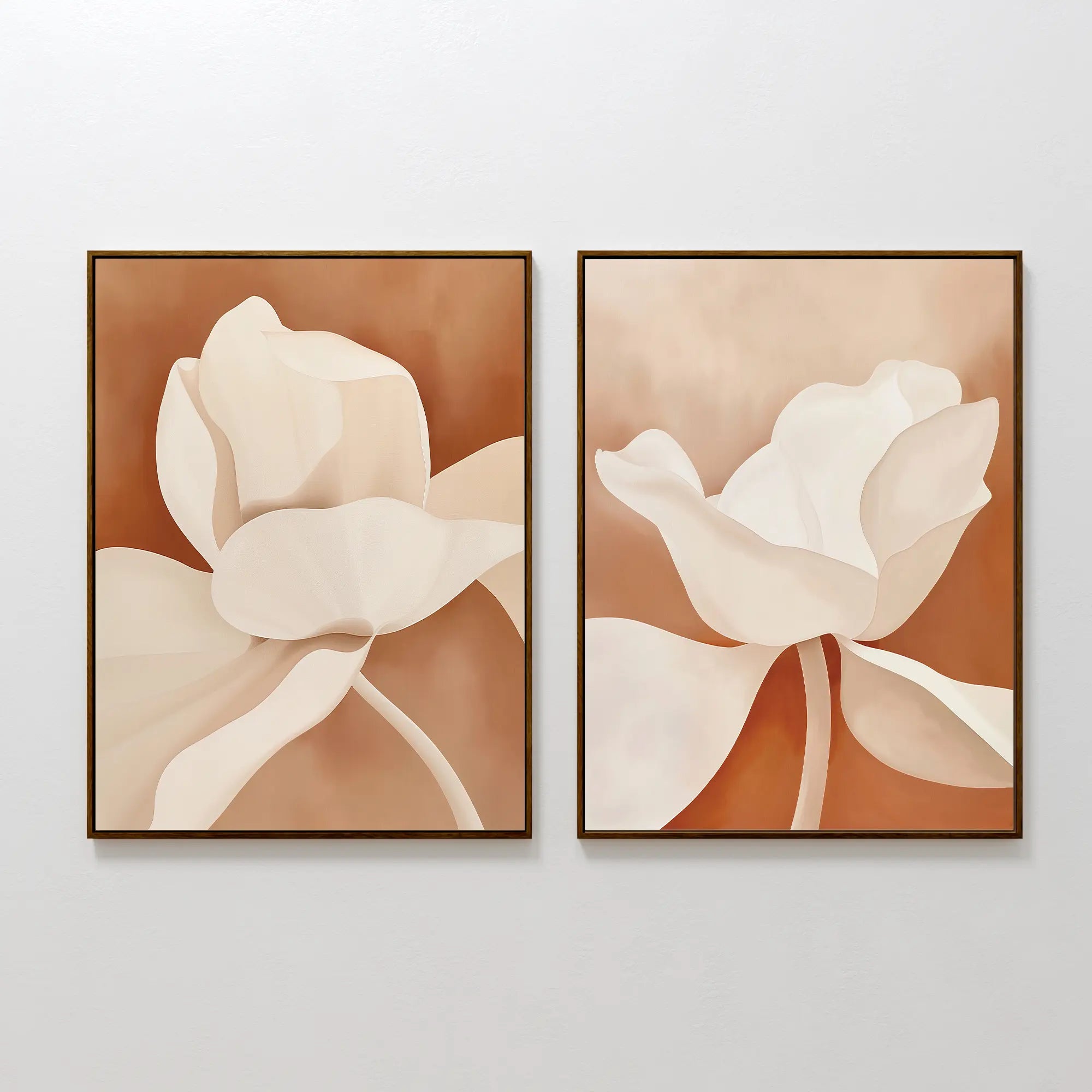 The Clay Blossom Set of 2 features framed abstract floral prints in soft beige, cream, and brown tones. Hung side by side, they create elegant terracotta wall decor with close-up flower petals on a neutral background.