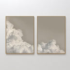 The Clouded Dreams Set of 2 features framed wall art prints depicting soft clouds against a muted beige sky, creating a minimalist canvas set perfect for elevating your living room decor.
