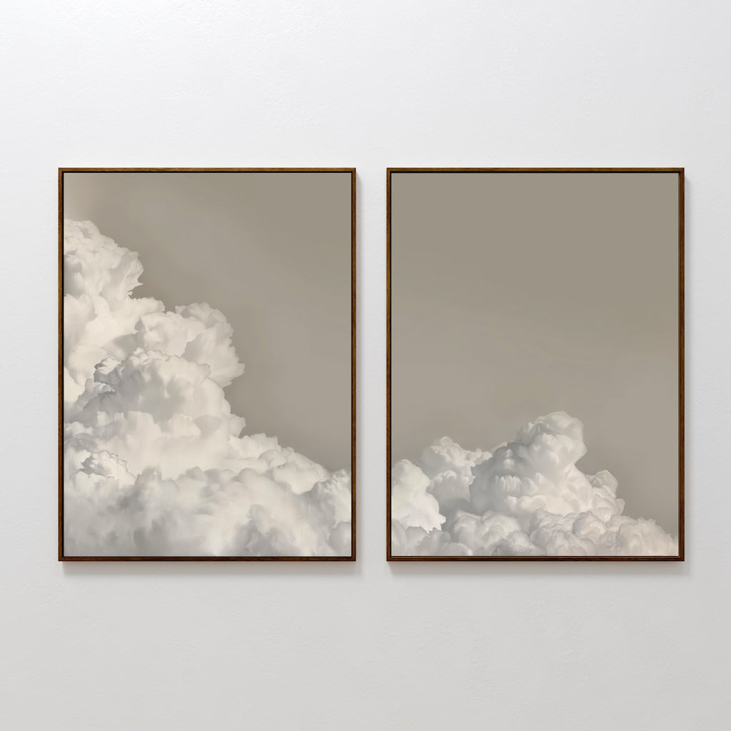The Clouded Dreams Set of 2 includes minimalist canvas prints featuring fluffy white clouds on a soft beige-gray sky. The left print has more clouds, while the right is more open and airy—ideal for stylish living room decor.