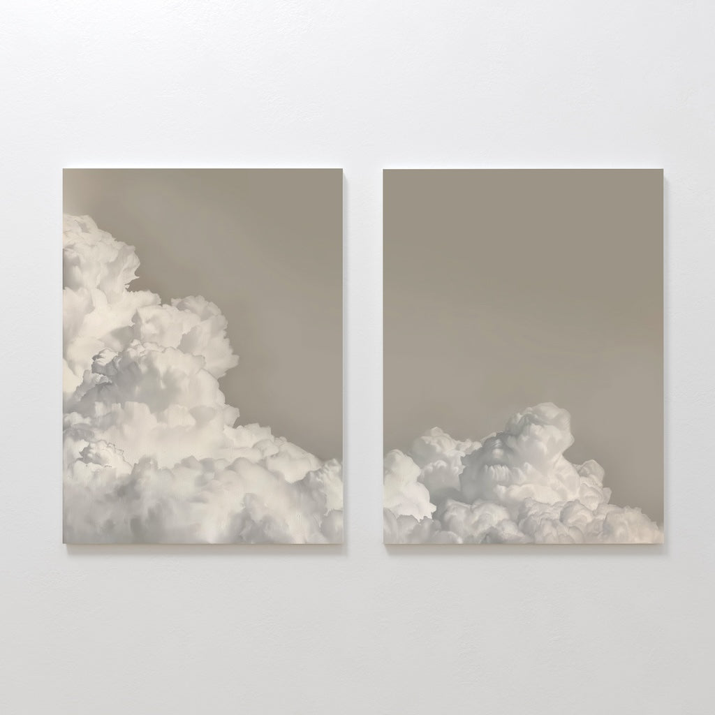 The Clouded Dreams Set of 2 features minimalist canvas paintings showing soft white clouds on a light beige sky, hanging side by side—an ideal set to elevate your living room decor.