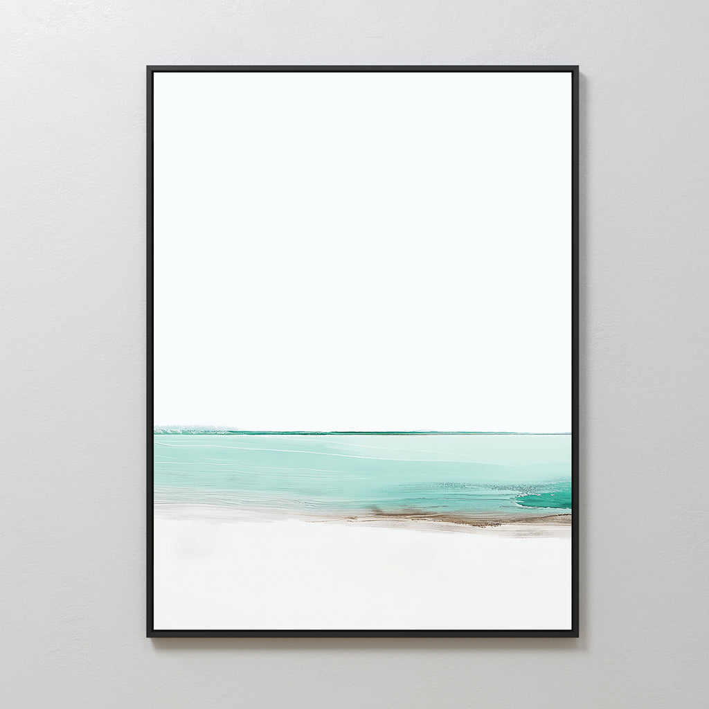 Coastal Breeze Abstract Canvas Art features a minimalist seascape with soft turquoise water, sandy accents, and a white sky in a sleek black frame—perfect coastal wall art for a light gray wall.