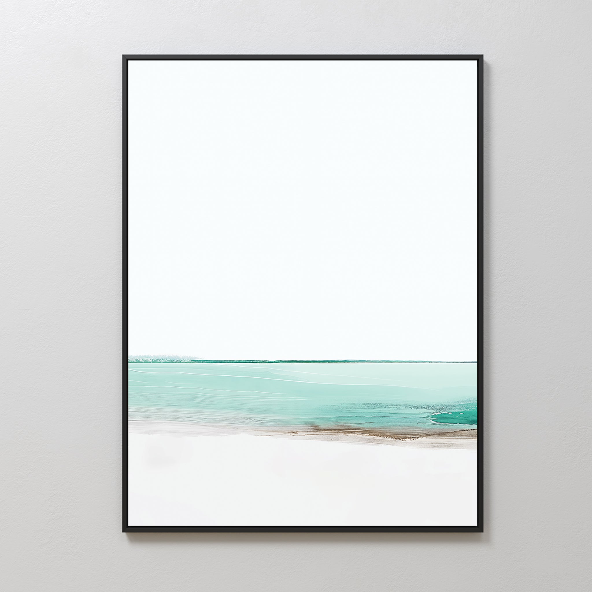 Coastal Breeze Abstract Canvas Art features a minimalist seascape with soft turquoise water, sandy accents, and a white sky in a sleek black frame—perfect coastal wall art for a light gray wall.