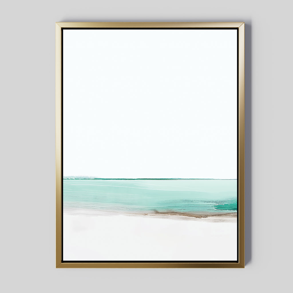 Coastal Breeze Abstract Canvas Art features minimalist gold-framed wall art with soft brushstrokes of a turquoise sea and white sand under a pale sky, adding serene modern elegance to any living room decor.