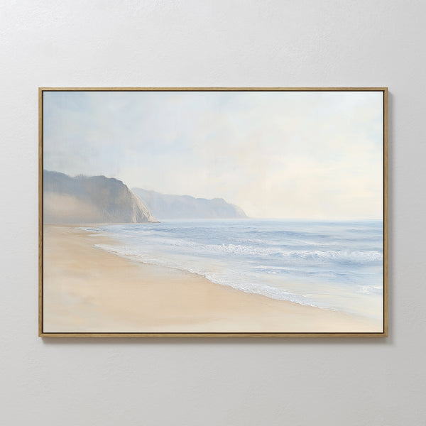 Coastal Cliffs Canvas Art features a serene beach landscape with gentle waves and distant cliffs beneath a soft, cloudy sky, adding tranquil beauty to any modern home decor.