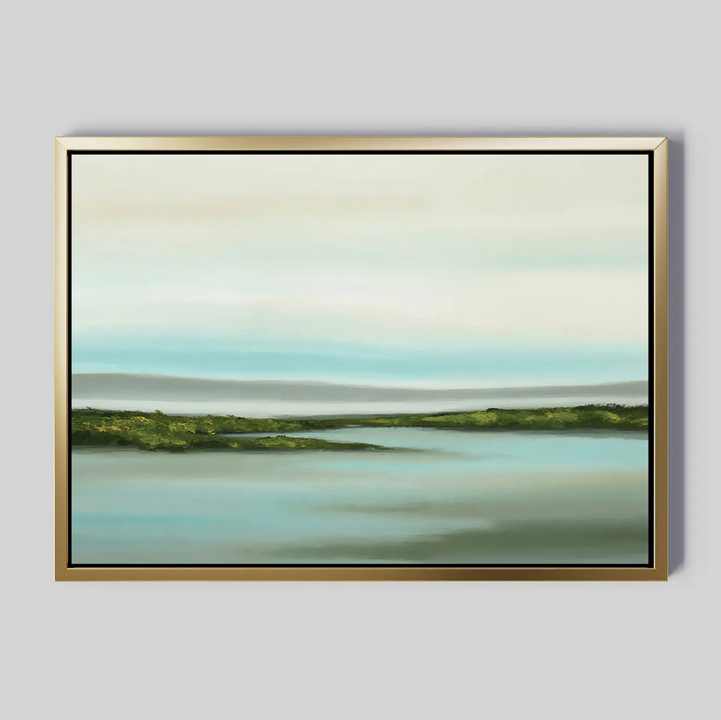 The Coastal Marsh Canvas Art showcases calm blue water, green marshland, and a pale sky with soft clouds. Its gold frame with a black inner edge delivers minimalist elegance, making it perfect wall art for any space.