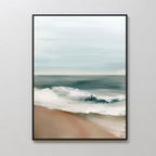 Coastal Whisper Abstract Canvas Art features waves crashing onto a sandy shore beneath a cloudy sky. This large, framed piece adds a calming vibe to any living room decor and looks stunning on light-colored walls.