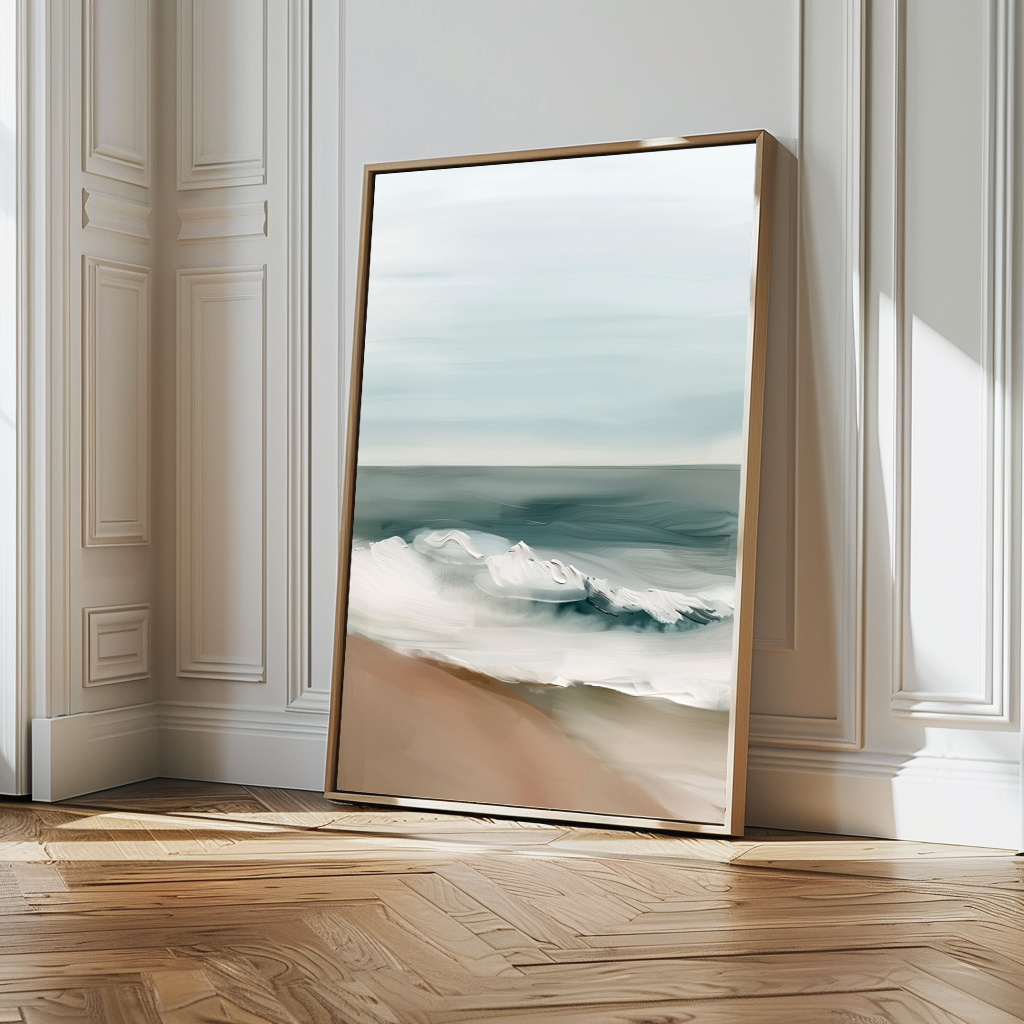The Coastal Whisper Abstract Canvas Art, featuring ocean waves on a sandy beach, leans against an ornate white wall in a bright room with herringbone floors. Soft side light casts gentle shadows, making it stunning large wall art.