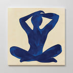Cobalt Figure Canvas Art: A minimalist canvas print of a seated human figure in deep blue on a light beige background, with crossed legs and arms behind the head—no facial features. Modern abstract wall art for stylish spaces.