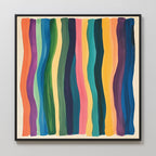 Color Flow Canvas Art showcases vertical wavy stripes in orange, blue, green, yellow, and pink on a cream background with a black frame—ideal as distinctive living room wall decor.