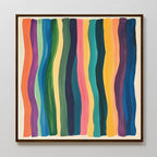 Color Flow Canvas Art is a framed abstract wall piece with wavy vertical stripes in purple, green, yellow, orange, pink, and blue on a light background—perfect for vibrant living room decor.