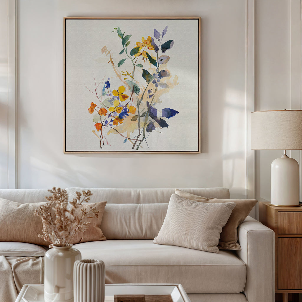 A bright living room with a white sofa, beige cushions, a wooden side table with a lamp, dried flowers in vases, and the Colorful Branches Canvas Art featuring vibrant floral designs hanging above the sofa—ideal for chic living room decor.