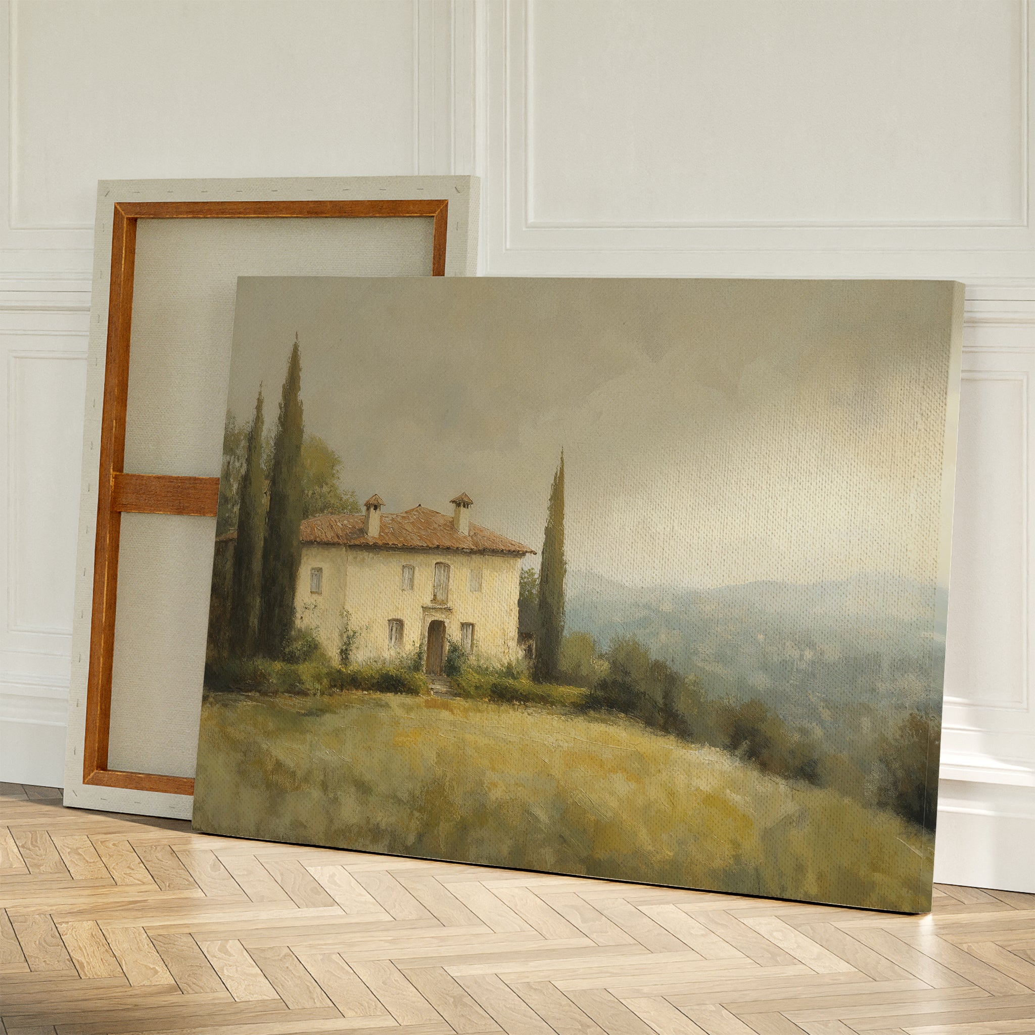Country Villa Canvas Art features a countryside house with tall trees, set against a wall on a wooden floor with a background canvas. Soft light and muted tones evoke calm, rustic charm—perfect for living room decor.
