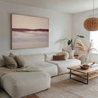 Neutral-toned living room with a beige sectional sofa, woven accents, wooden coffee table, pampas grass in a vase, and Crimson Horizon Abstract Canvas Art above the sofa, all bathed in soft natural light for stylish decor.