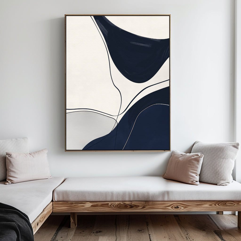 Minimalist living room with a wooden daybed, light cushions, and the Curved Lines Abstract Canvas Art in navy blue, black, and white. Its clean lines and shapes add a sophisticated touch to this modern decor.