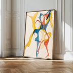 The Dance Of Unity Abstract Canvas Art, with vibrant yellow, blue, and red flowing shapes, leans against a white-paneled wall in a sunlit room with wooden flooring—ideal for modern living room decor.