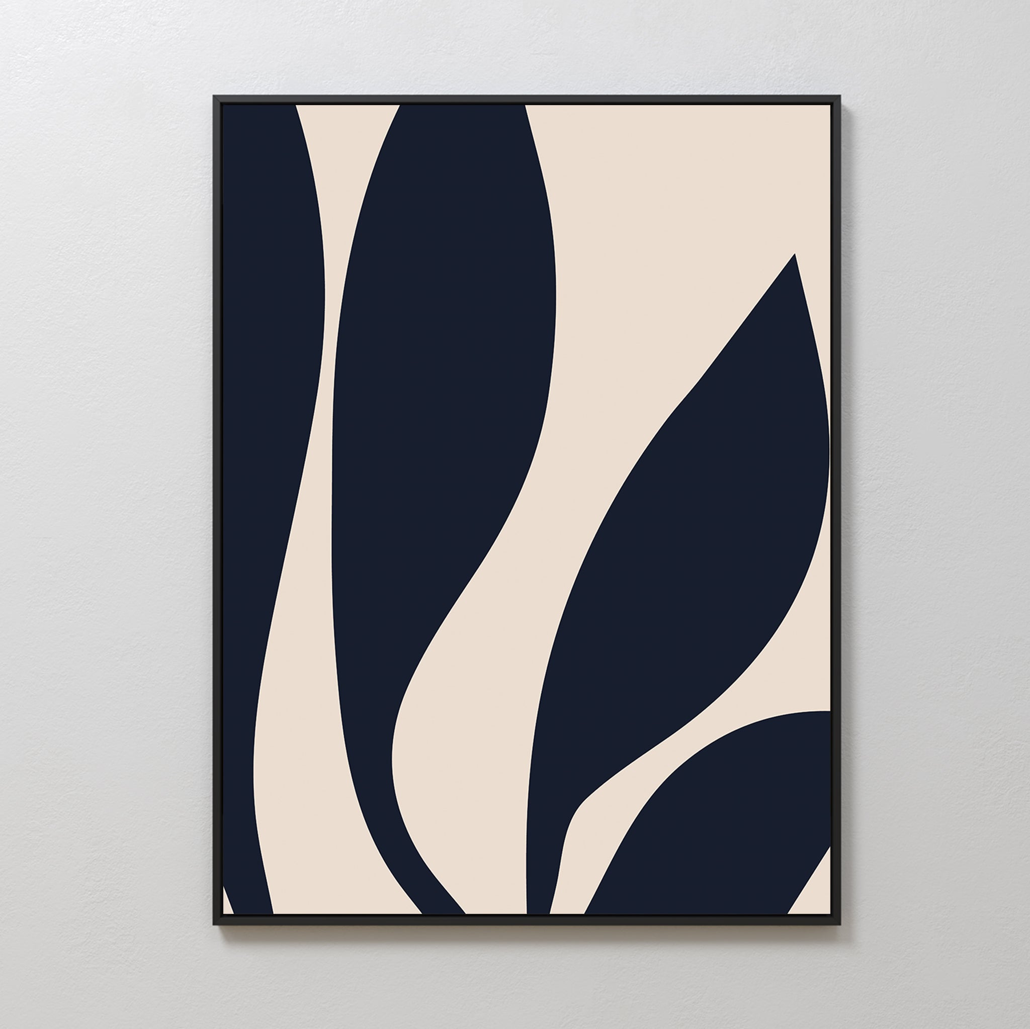 The Dark Blue Leaves Abstract Canvas Art showcases minimalist navy leaf shapes on a light beige background, framed in thin black and displayed on a white wall—perfect for adding modern elegance to your space.