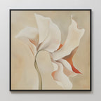 Delicate Bloom Abstract Canvas Art features soft white petals with beige and orange accents on a light background, framed in black—ideal minimalist wall decor for a modern living room.