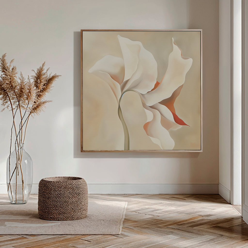 A minimalist room exudes modern elegance with the Delicate Bloom Abstract Canvas Art as a focal point, enhanced by a clear vase of dried pampas grass, a woven pouf, light rug, and wood herringbone floor in neutral earthy tones.