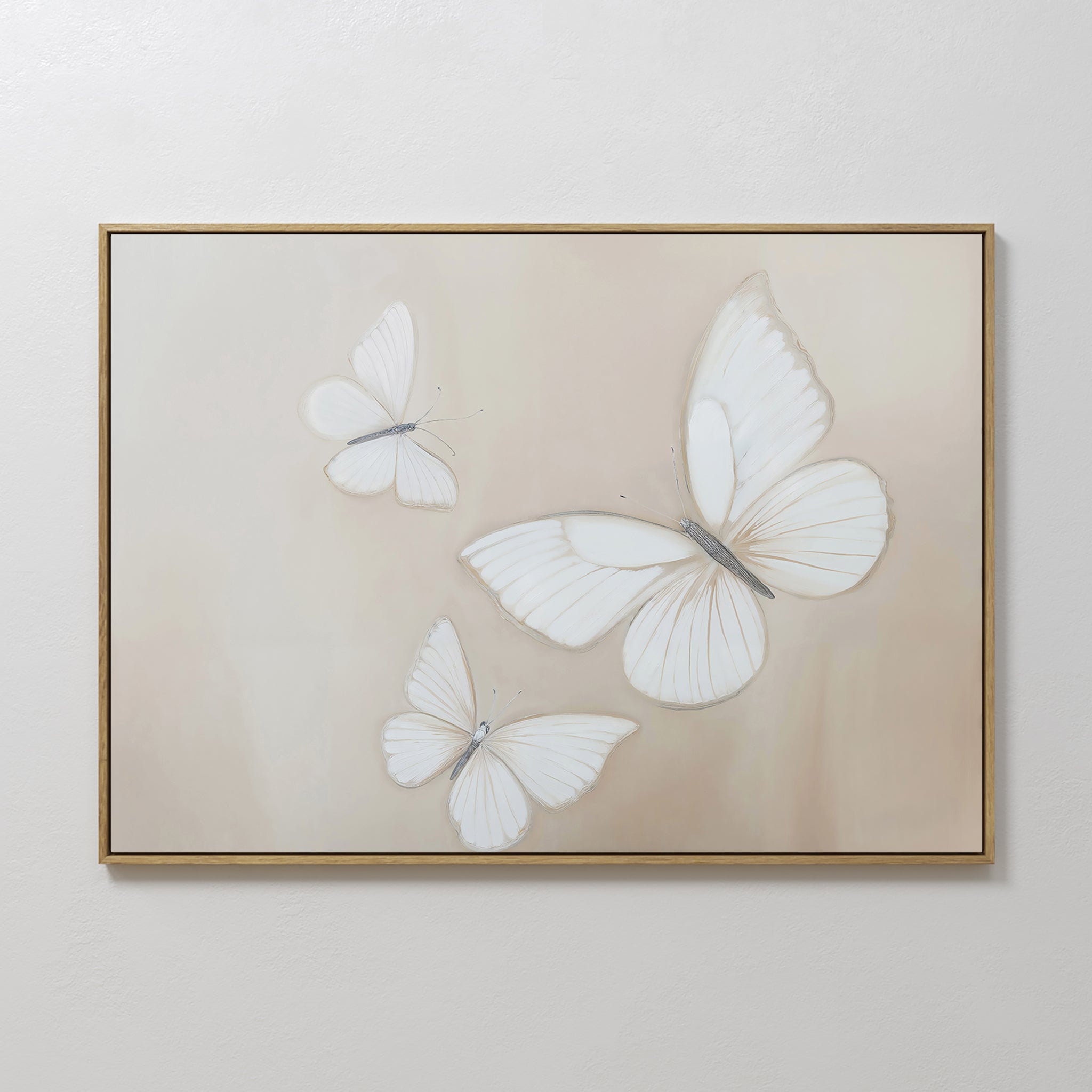 The Delicate Whites Canvas Art showcases three white butterflies with delicate wings on a light beige background, framed in thin gold—a perfect minimalist wall decor choice for any Nordic Park-inspired or neutral space.