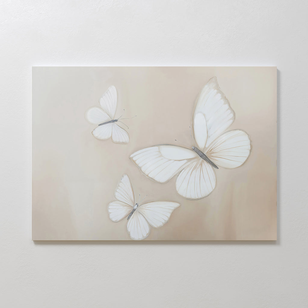 Delicate Whites Canvas Art features three white butterflies with translucent wings on a soft beige background, adding gentle movement and elegance—perfect neutral wall decor for any Nordic Park-inspired space.