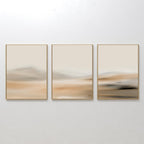 The Desert Haze Set of 3 features abstract wall art prints in gold frames with soft, blurred beige and tan tones, creating a minimalist landscape look—ideal for enhancing your living room decor.