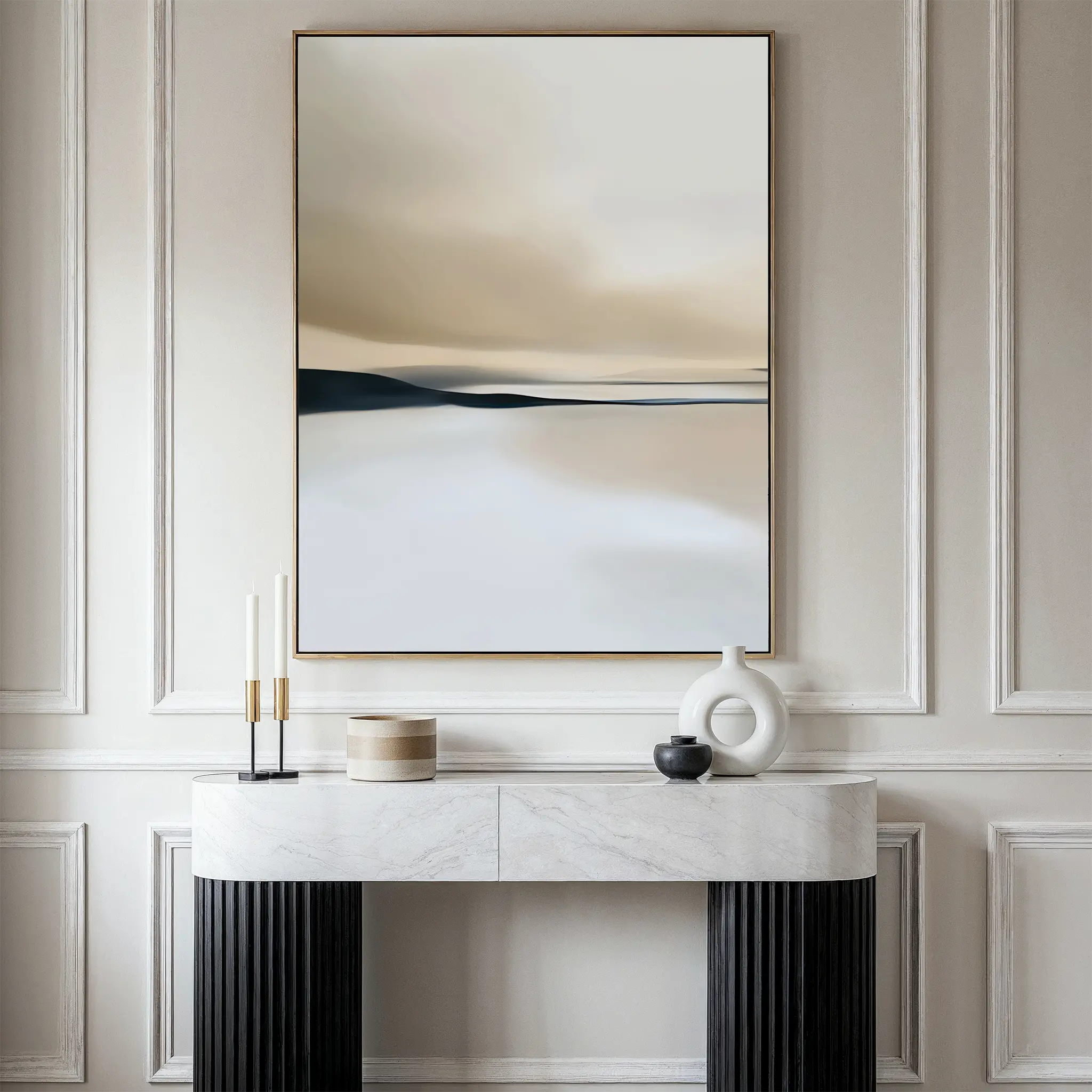 A minimalist entryway features a black and white console with candles, jars, and vases beneath the Desert Quietude Canvas Art – Vertical—large, neutral-toned wall art on a paneled wall—perfect chic living room decor inspiration.