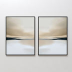 The Desert Quietude Set of 2 features framed abstract landscapes in soft beige, brown, and blue tones with blurred horizons. This minimalist wall art brings a calm, elegant touch to any living room when displayed on a white wall.