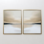 The Desert Quietude Set of 2 features abstract desert landscapes in gold frames, with soft beige, brown, and blue tones and blurred horizons—ideal minimalist wall art to bring a calm, serene touch to your living room decor.