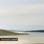 Distant Shores Canvas Art features a minimalist coastal landscape with soft blue water, sandy shores, and green hills beneath a cloudy sky. "Zoomed-In Detail" appears in the bottom left, perfect for nature-inspired decor.
