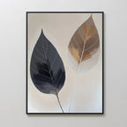 Dual Leaf Study Canvas Art displays two leaves—dark gray and brown with white veins—on a light beige background in a black frame. A perfect modern touch for bedroom decor.