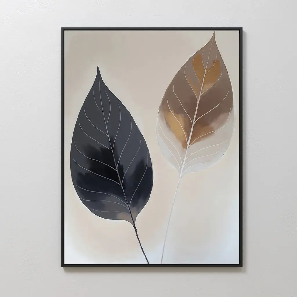 Dual Leaf Study Canvas Art displays two leaves—dark gray and brown with white veins—on a light beige background in a black frame. A perfect modern touch for bedroom decor.