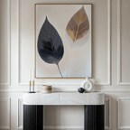 A minimalist console table with decor sits against an elegant paneled wall. Above, the Dual Leaf Study Canvas Art—a large painting of two stylized leaves—brings a striking, modern touch to this sophisticated bedroom.