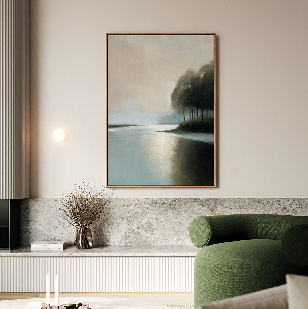A modern living room with calming decor, featuring Dusklake Canvas Art as minimalist wall art above a green curved sofa, a marble shelf, a small vase with dried branches, and a minimal round wall light.