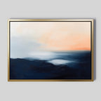 The Dusk Ridge Canvas Art features abstract landscape wall art in a gold frame with dark blue, light blue, and peach hues evoking sunrise or sunset on a light-gray background—perfect tranquil decor for bedrooms.