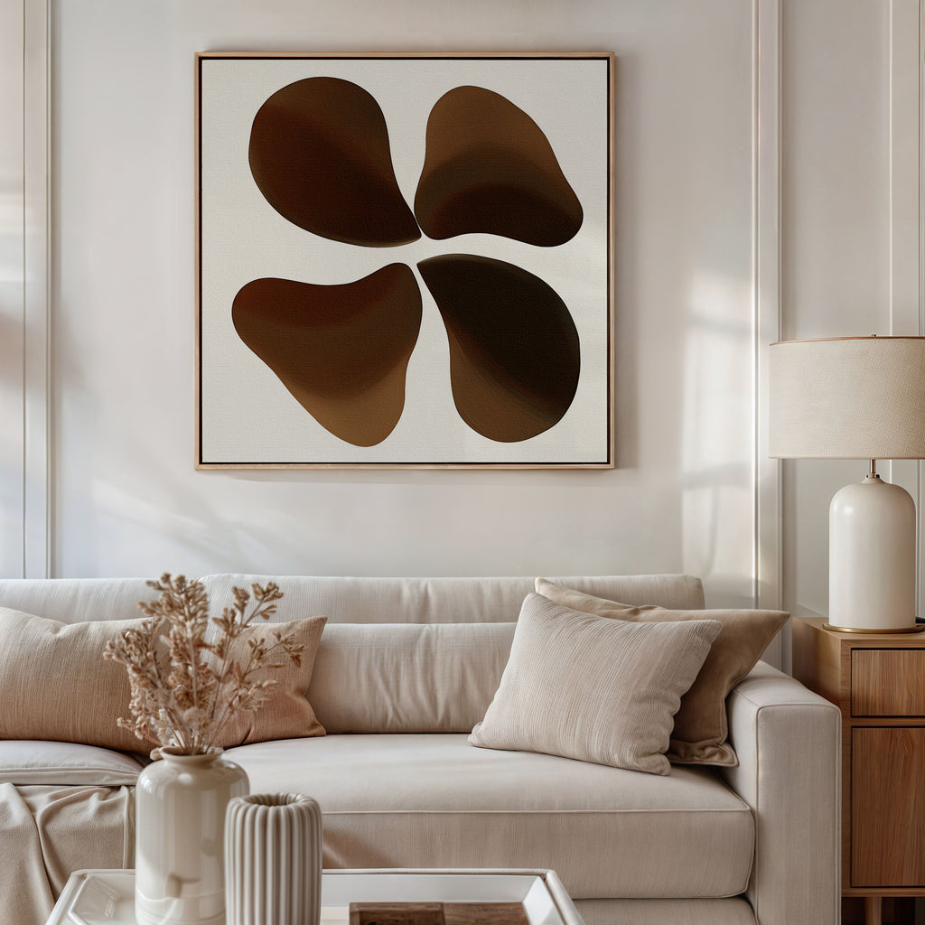 A modern living room features a neutral-toned sofa, beige cushions, a side table with lamp, earthy blooms in a vase, and the Earthy Blooms Canvas Art—an abstract piece in brown and beige tones—hanging on the wall.