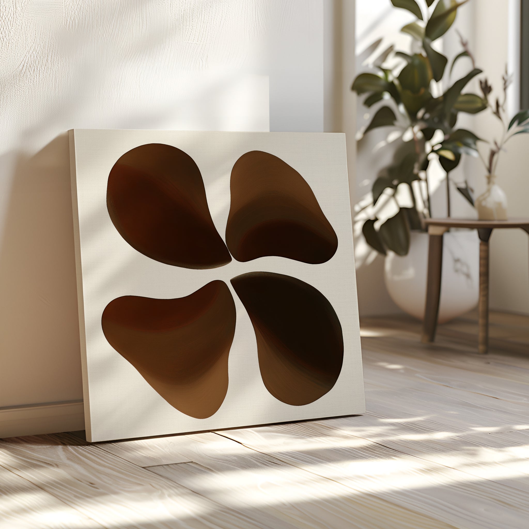 The Earthy Blooms Canvas Art, with four abstract earthy blooms, leans against a sunlit wall beside a potted plant and wooden table, bringing minimalist charm to the light wood floor.
