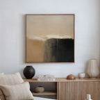 A minimalist living room with neutral decor features a beige couch, a wooden sideboard, and Earthy Cliffs Abstract Canvas Art in beige, white, and black as striking wall art above the seating area.
